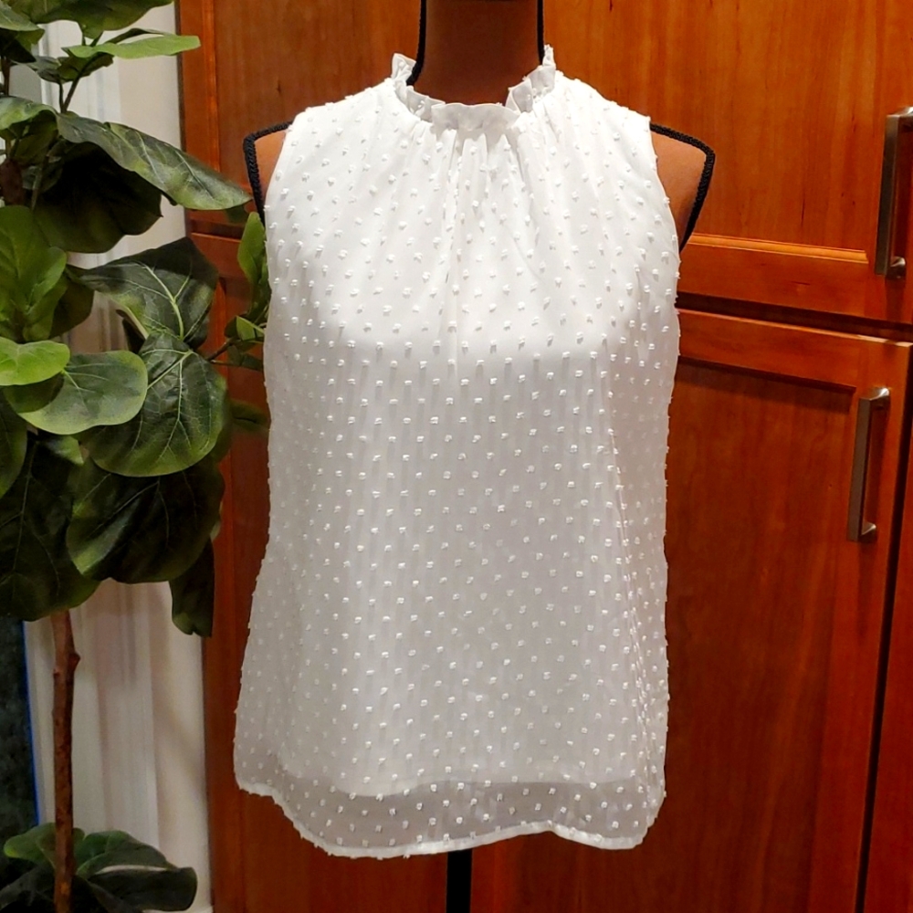 White sleeveless top